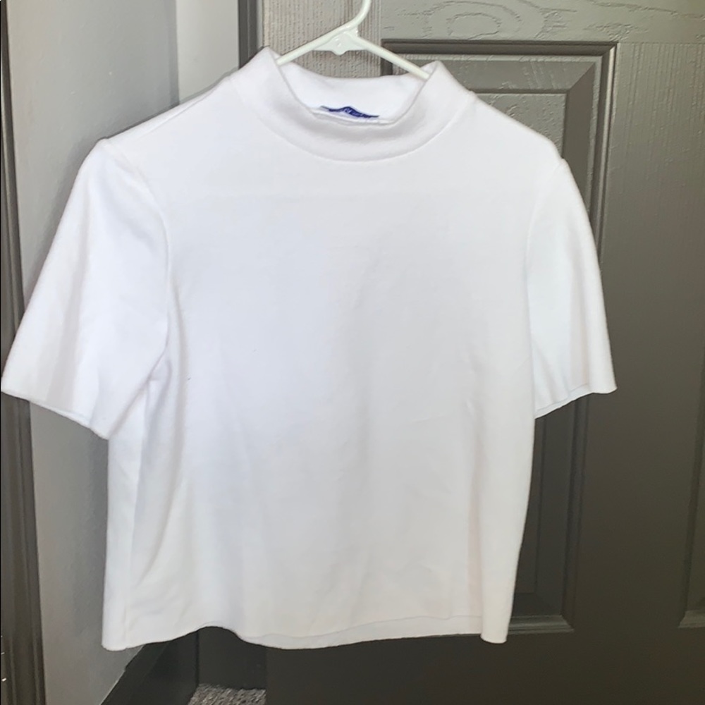 Very soft white mock neck T-shirt.